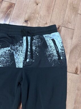 Men’s black jogger sweatpants with paint splattered look Large